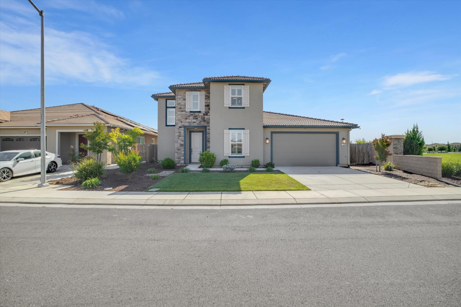 1898 Sanza Road Manteca, CA 95337 - Photo 3 of 41 a view of a house with a swimming pool