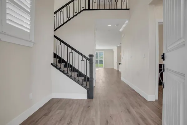 a view of entryway with wooden floor