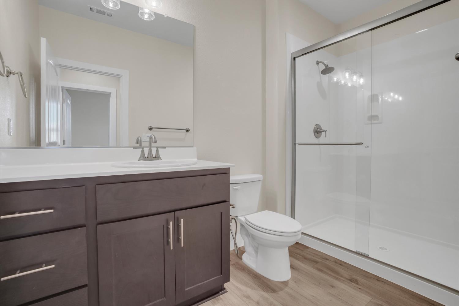 1898 Sanza Road Manteca, CA 95337 - Photo 6 of 41 a bathroom with a sink a toilet and shower