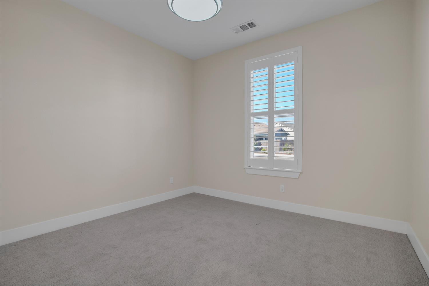 1898 Sanza Road Manteca, CA 95337 - Photo 7 of 41 an empty room with a window