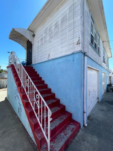 a view of balcony with wooden floor and stairs