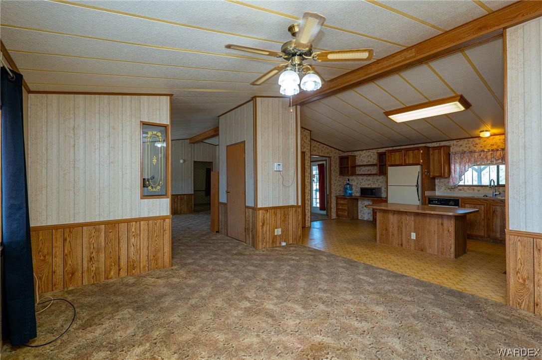 1890 East El Rodeo Road Fort Mohave, AZ 86426 - Photo 7 of 40 a view of a livingroom with furniture and a flat screen tv