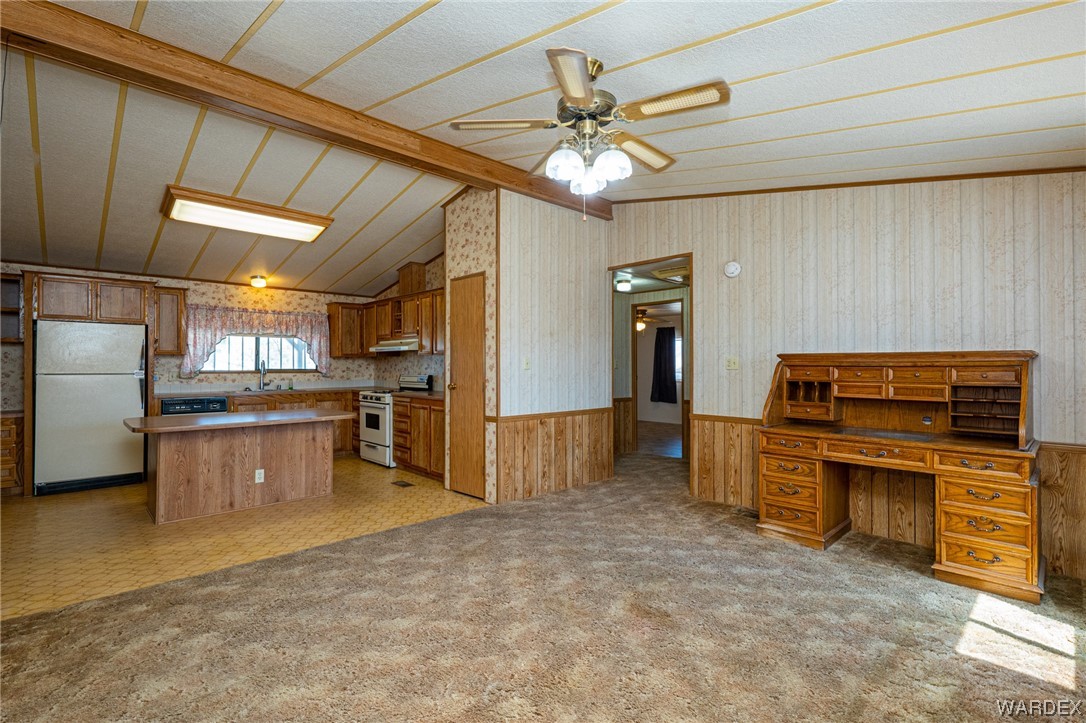 1890 East El Rodeo Road Fort Mohave, AZ 86426 - Photo 8 of 40 a large kitchen with cabinets and stainless steel appliances