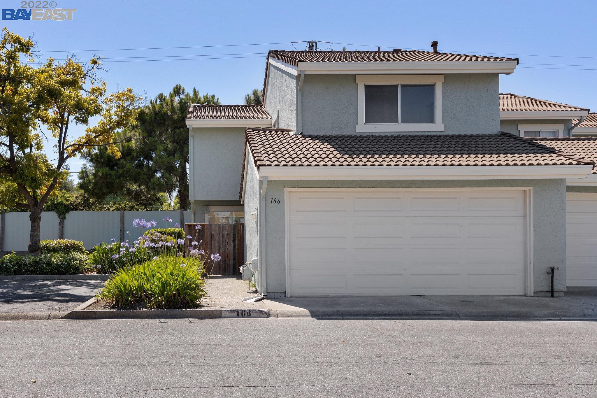 a front view of a house with a garage