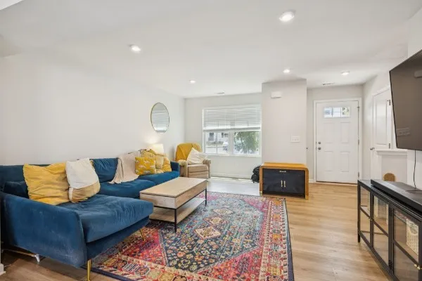 a living room with furniture and a flat screen tv