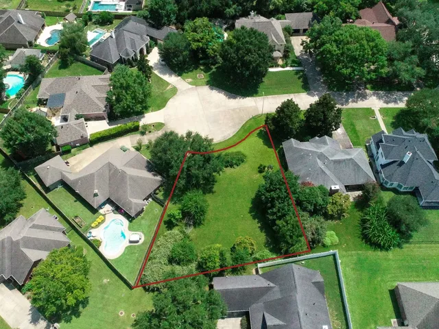an aerial view of house with yard swimming pool and outdoor seating
