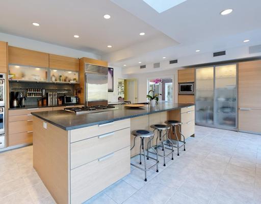 115 Lockwood Road Riverside, CT 06878 - Photo 5 of 10 a kitchen with stainless steel appliances kitchen island granite countertop a table and chairs