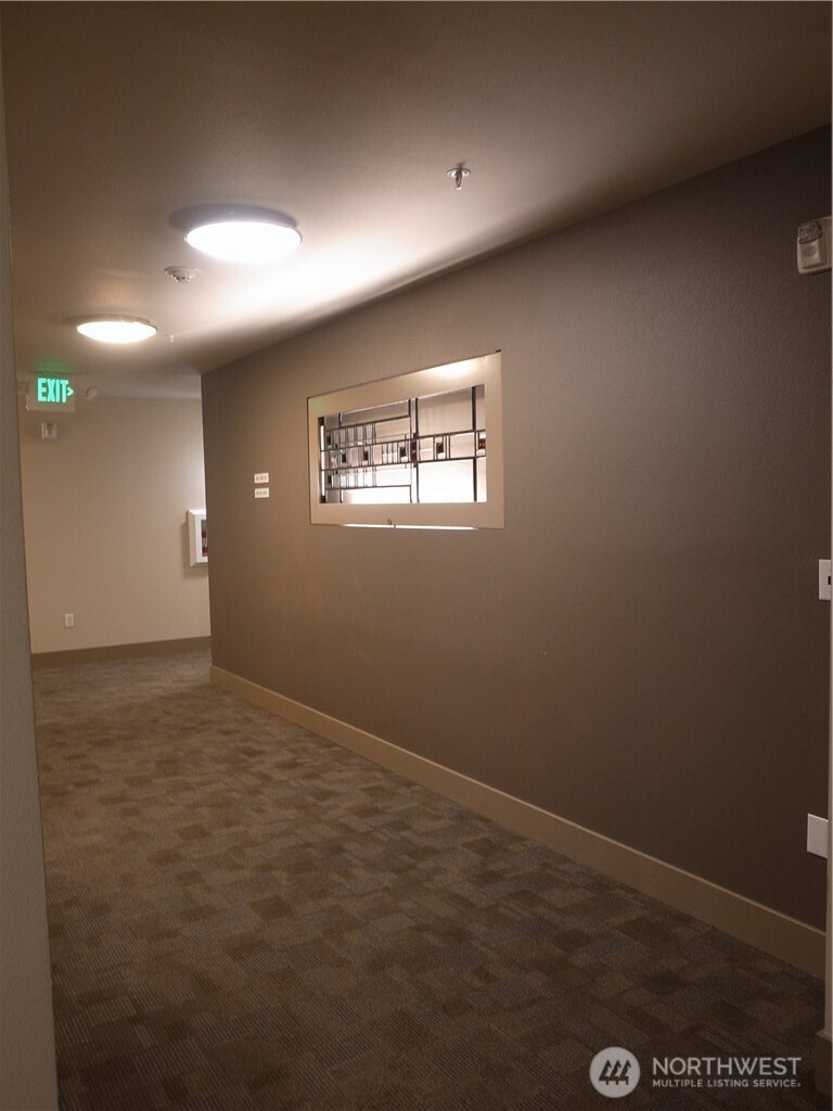 4547 8th Avenue Northeast, Unit 408 Seattle, WA 98105 - Photo 11 of 27 an empty room with a empty space and window