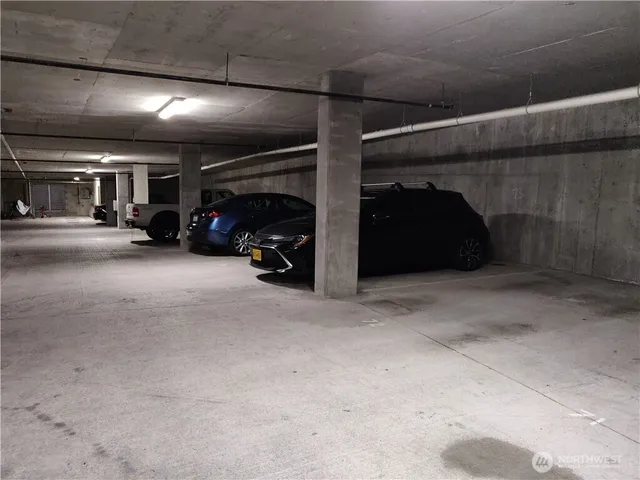 a bathroom with a sink vanity granite and toilet