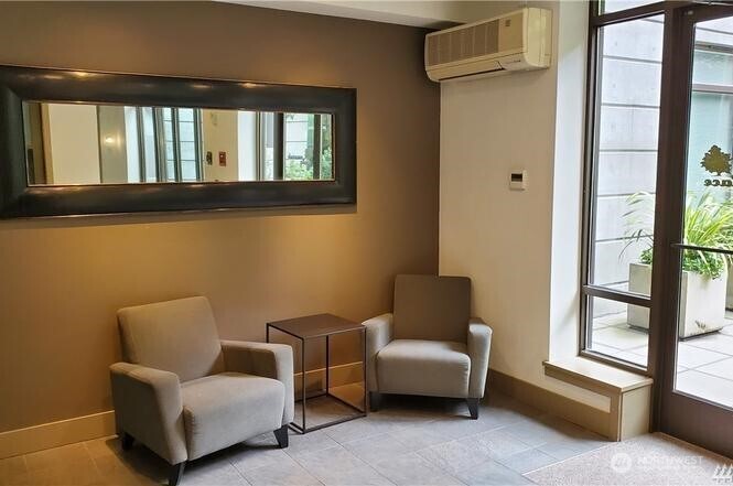 4547 8th Avenue Northeast, Unit 408 Seattle, WA 98105 - Photo 9 of 27 a living room with furniture and a window