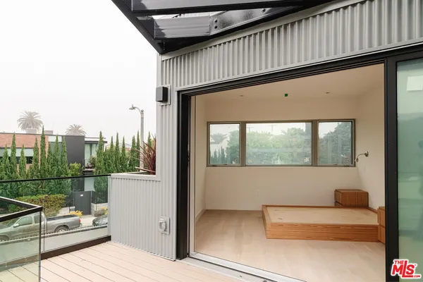 a view of a hallway with washer and dryer