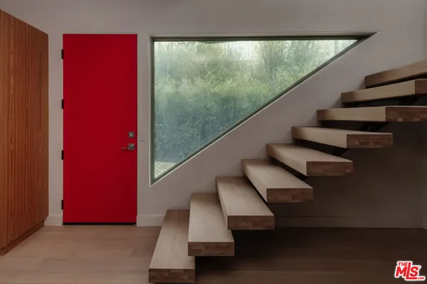 a kitchen with wooden cabinets and a stove top oven