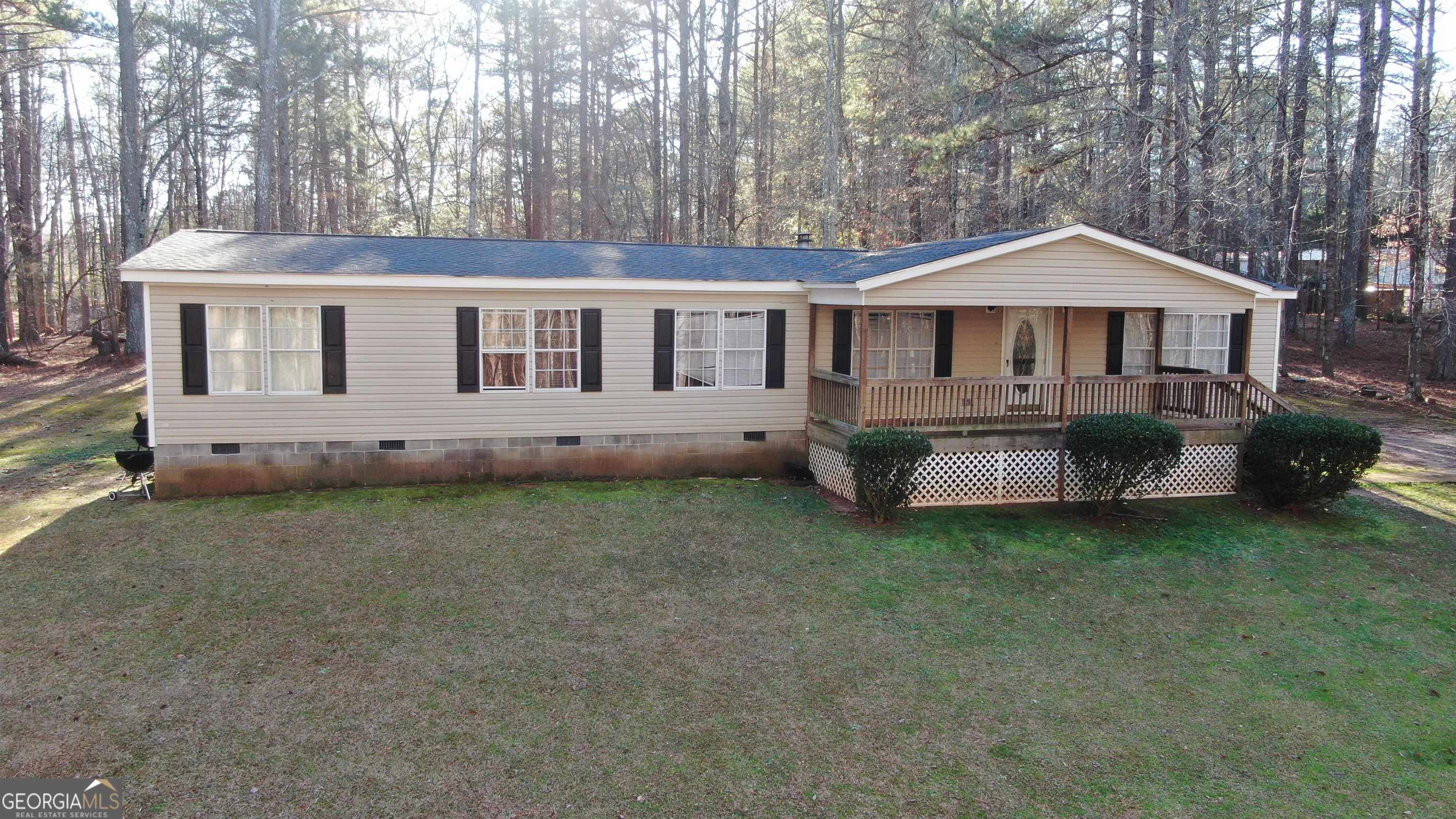 175 Crabapple Hollow Road Nicholson, GA 30565 - Photo 1 of 1 a front view of a house with garden