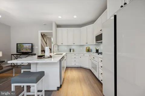 a kitchen with cabinets a sink and a stove