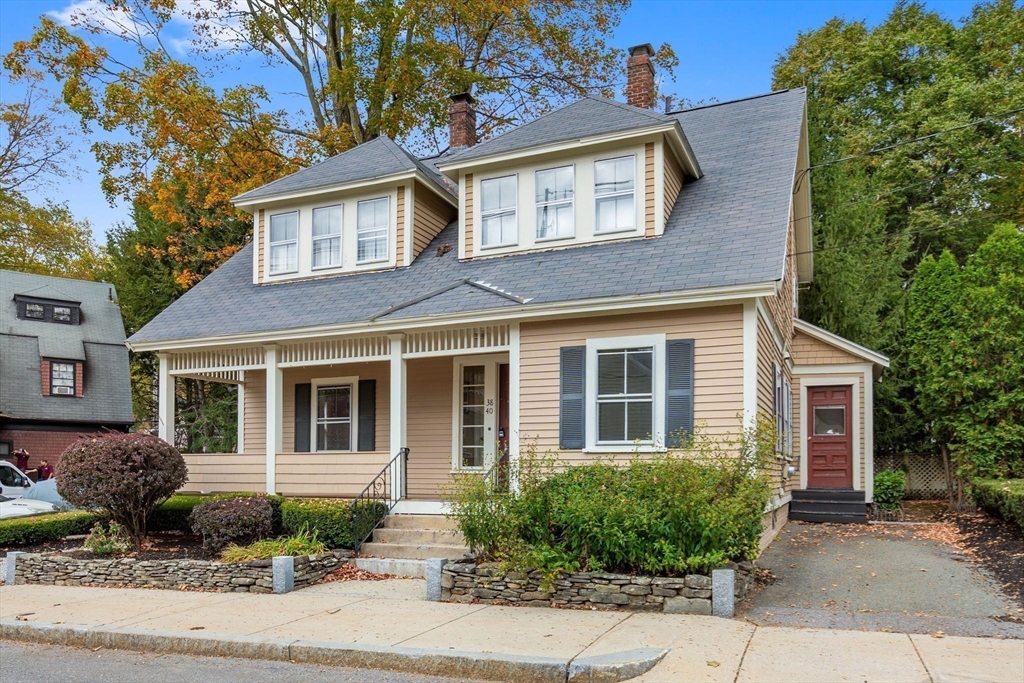 38-40 Court Lane Concord, MA 01742 - Photo 26 of 26 a front view of a house with a garden