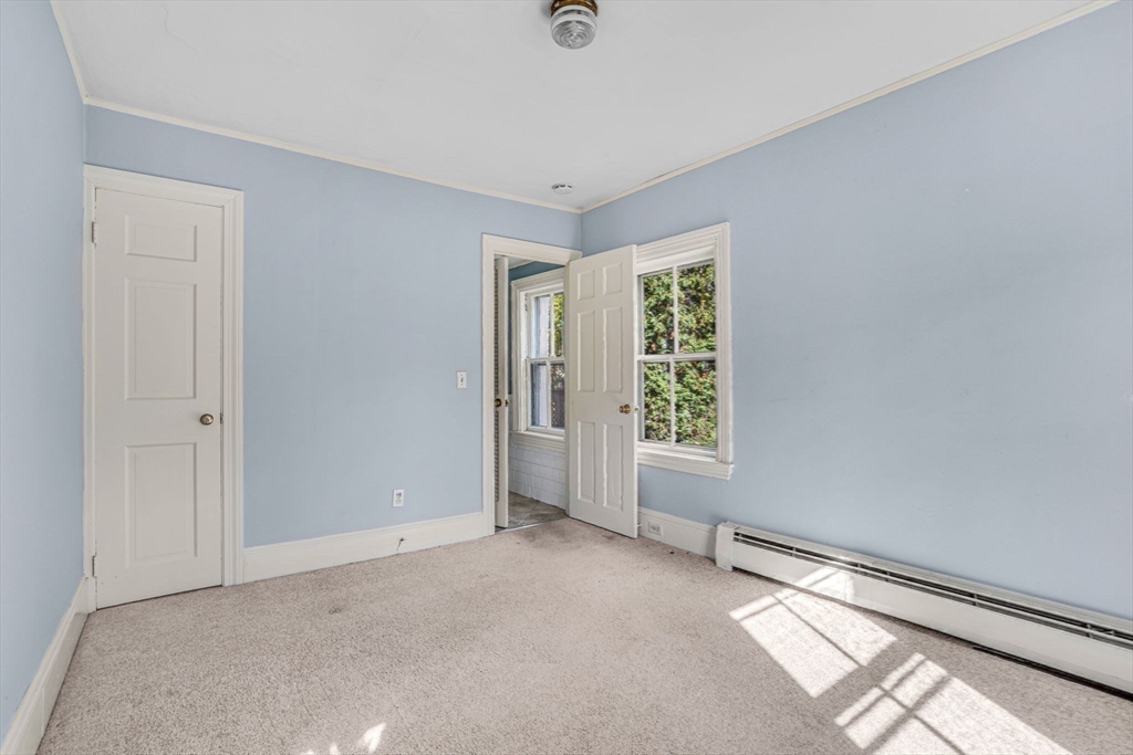38-40 Court Lane Concord, MA 01742 - Photo 8 of 26 a view of an empty room with a window