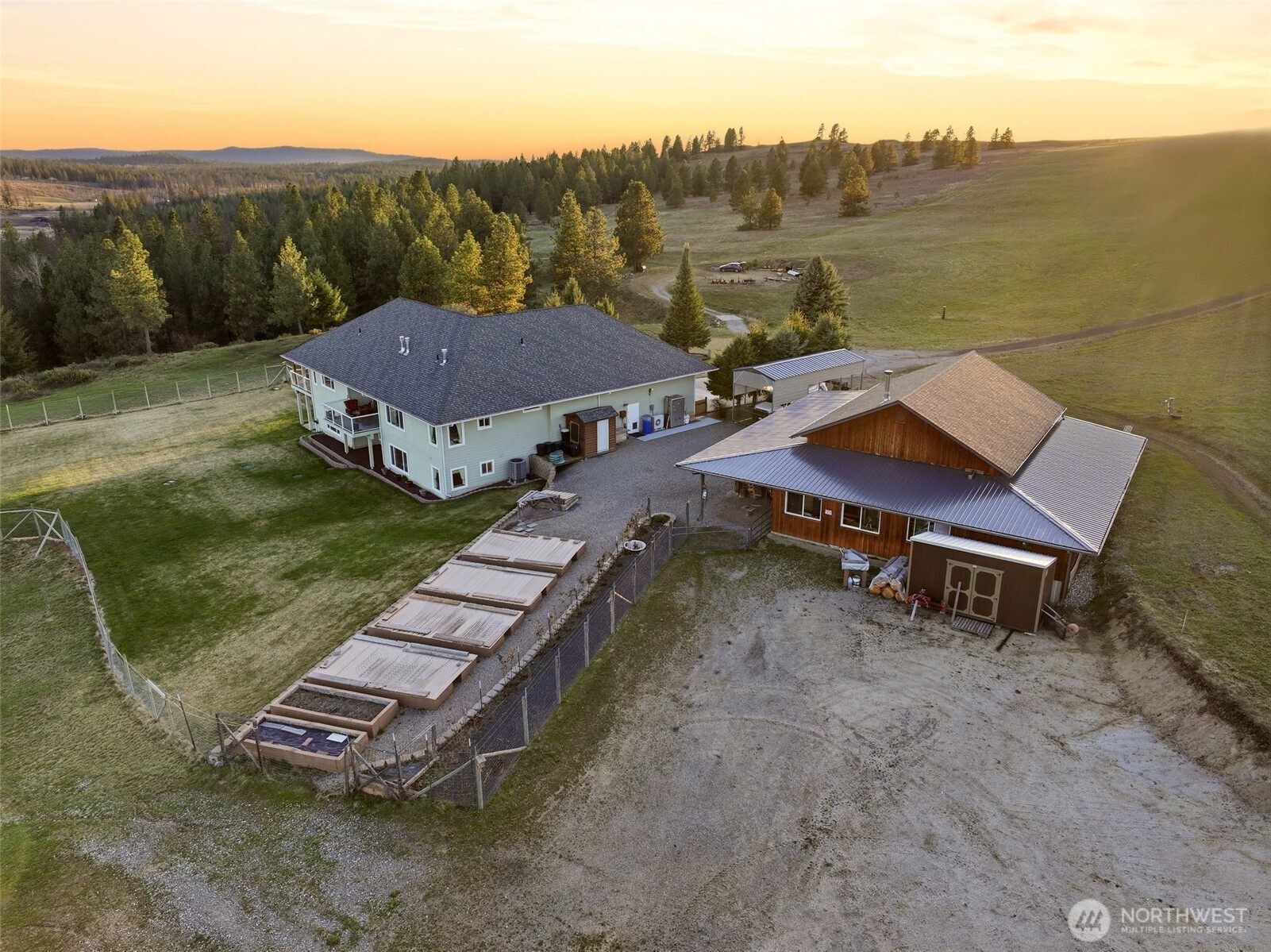 Undisclosed Address Elk, WA 99009 - Photo 11 of 40 an aerial view of a house with a yard