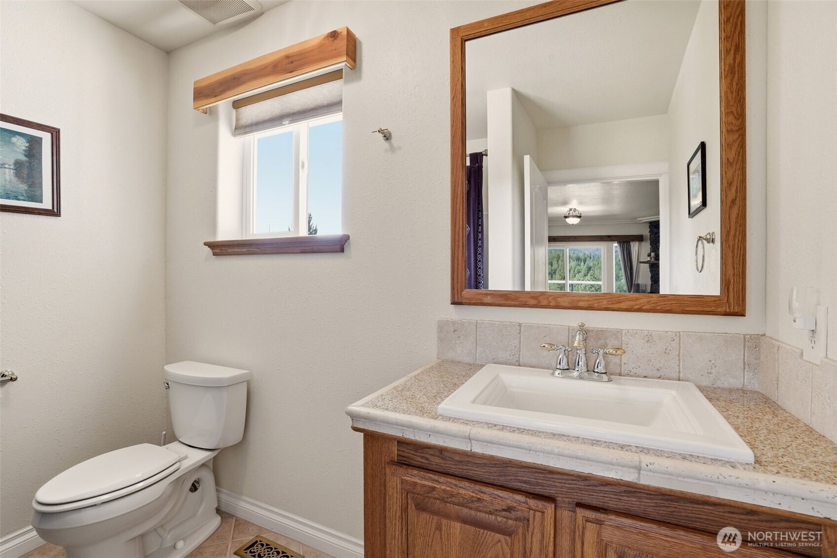 Undisclosed Address Elk, WA 99009 - Photo 21 of 40 a bathroom with a granite countertop sink a toilet and a mirror