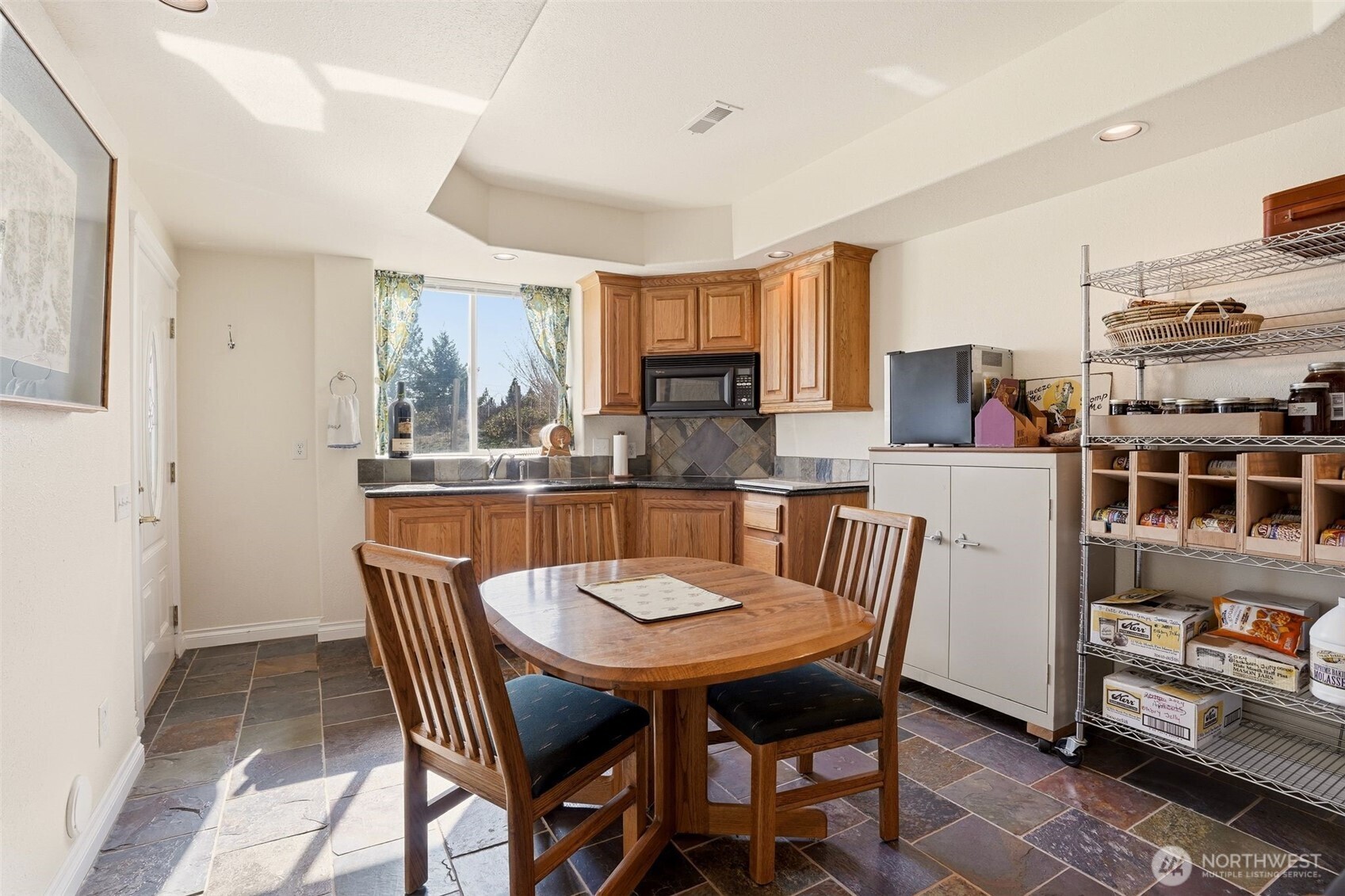 Undisclosed Address Elk, WA 99009 - Photo 23 of 40 a view of a dining room with furniture and a kitchen