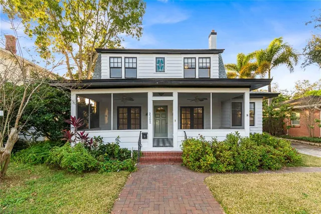 a bathroom with a black and white checkered floor