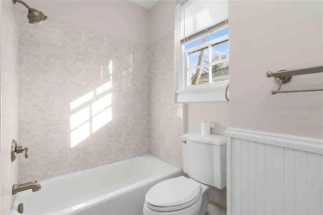 a view of entryway and hall with a front door