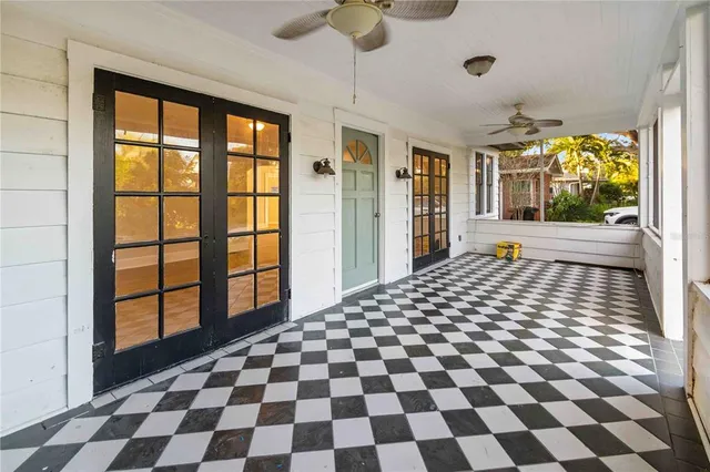 a view of empty room with wooden floor and fireplace