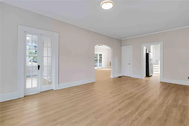 a kitchen with granite countertop a sink a window stainless steel appliances and cabinets