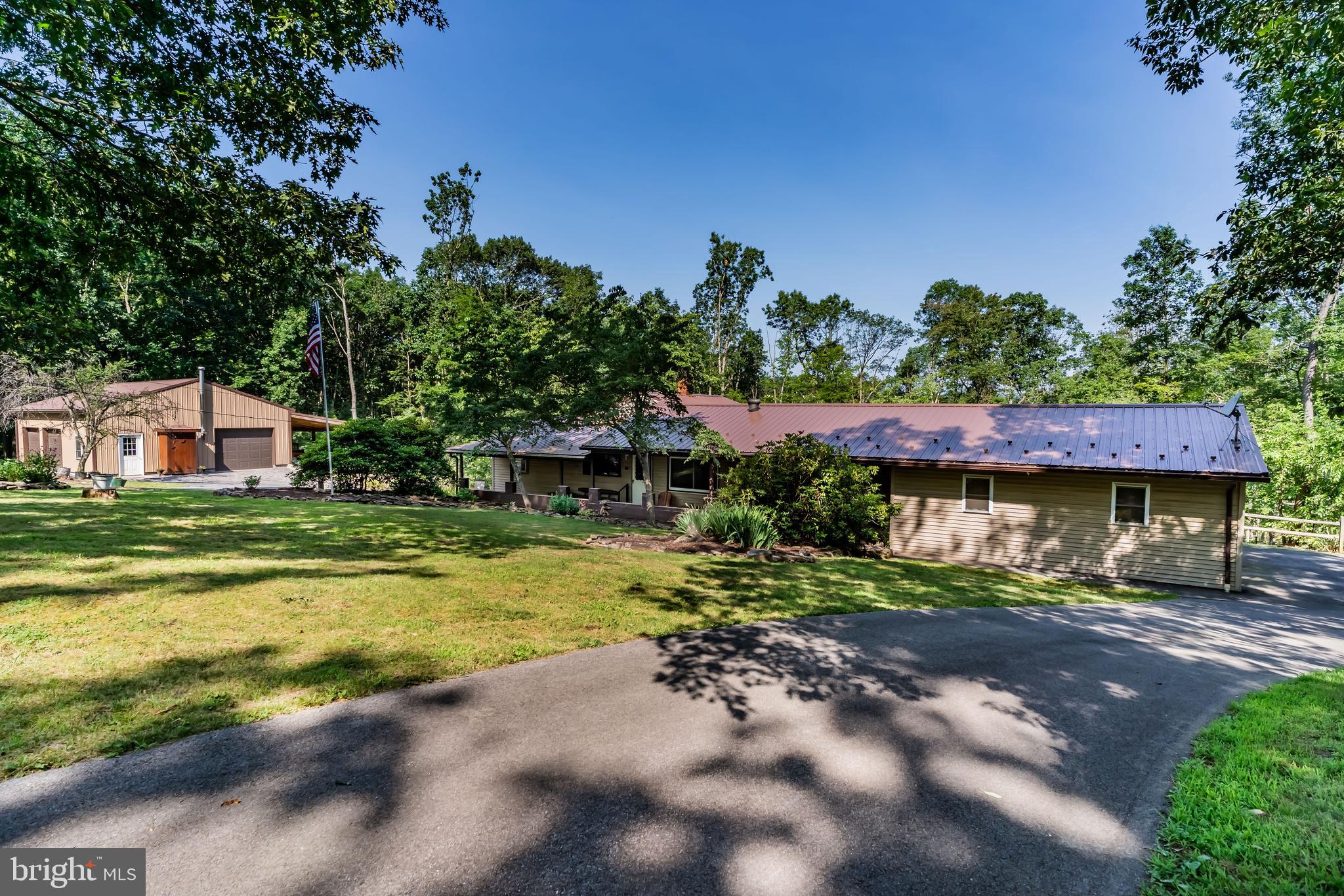 21429 Buck Trail Shade Gap, PA 17255 - Photo 2 of 42 a front view of a house with a garden
