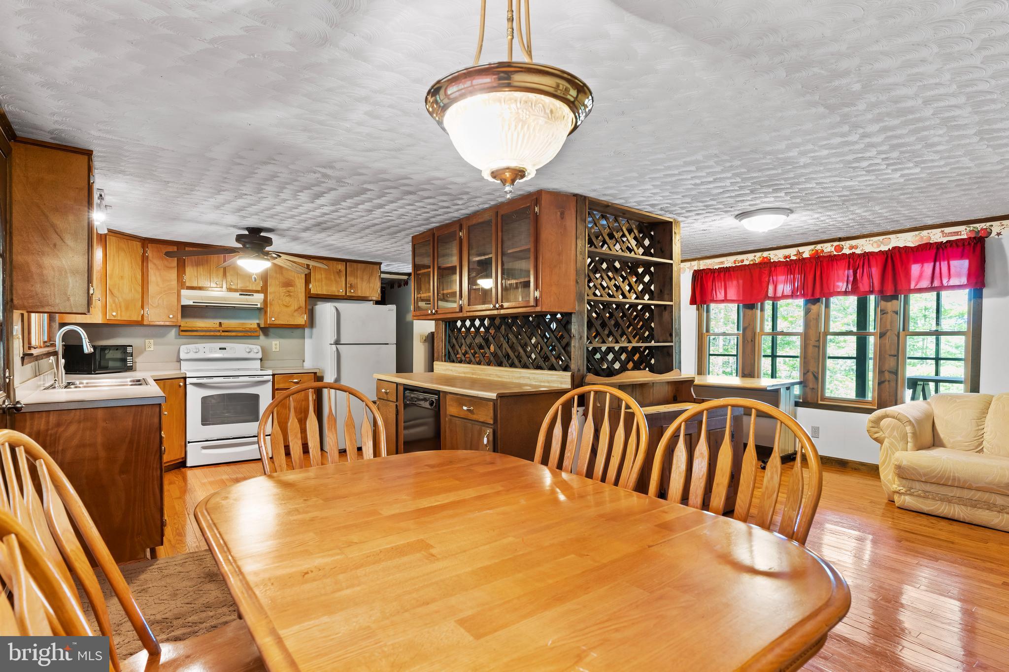 21429 Buck Trail Shade Gap, PA 17255 - Photo 7 of 42 a view of a dining room with furniture wooden floor and chandelier