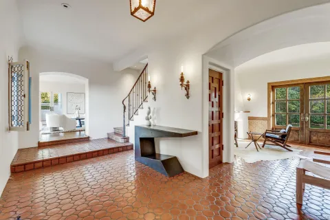a living room with furniture and a table