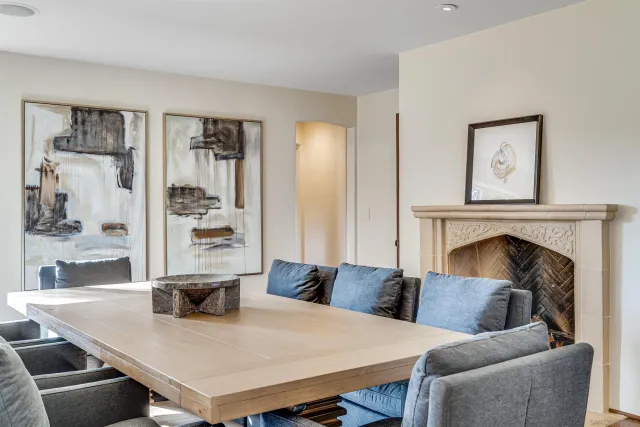 a view of a patio with table and chairs and potted plants
