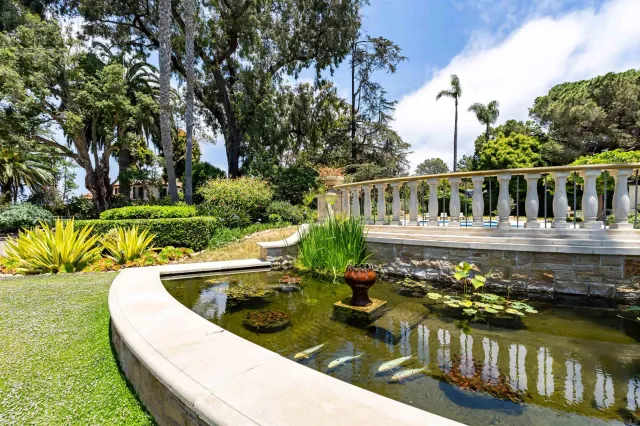 a view of living room with a fireplace furniture and floor to ceiling window