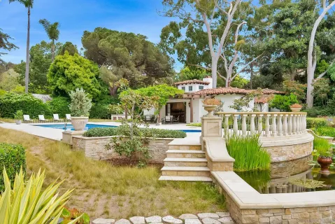 a view of a yard with basketball court