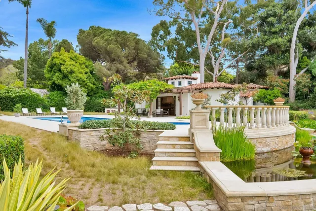 a view of a yard with basketball court