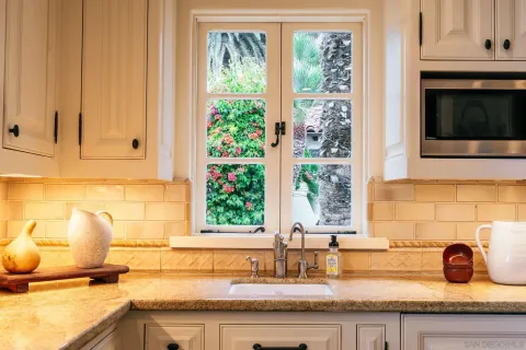 a kitchen with a sink and cabinets