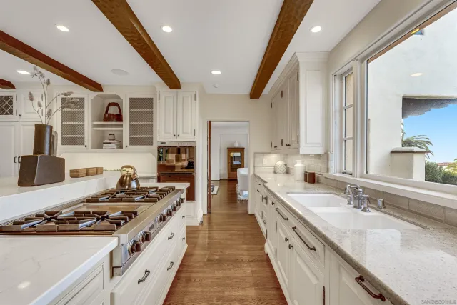 a living room with furniture a lamp and a chandelier