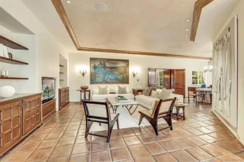 a view of a house with wooden stairs and floor to ceiling window