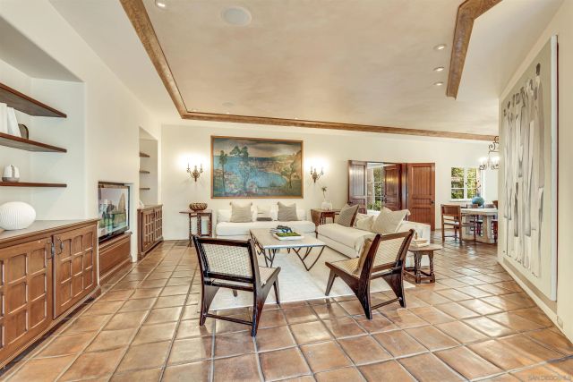 a view of a house with wooden stairs and floor to ceiling window