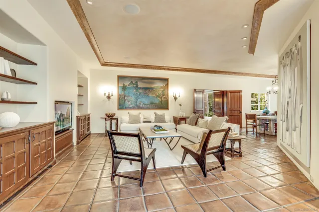 a view of a house with wooden stairs and floor to ceiling window