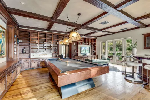 a bathroom with a granite countertop sink and a window
