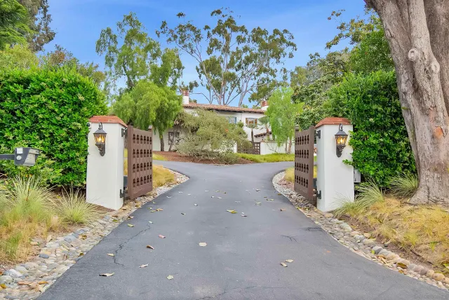 a front view of a house with a swimming pool
