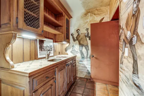 a bathroom with a sink and a window