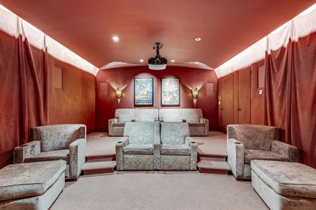 a view of a hallway with furniture and a window