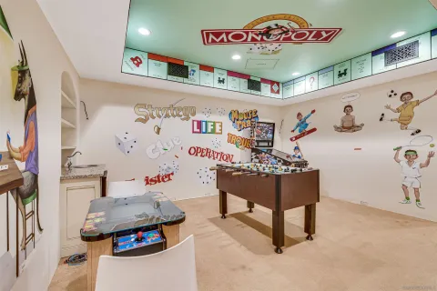 a bedroom with a bed lamp and large window