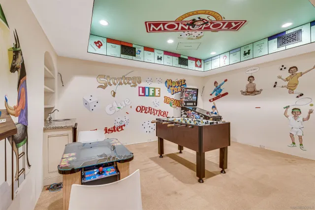 a bedroom with a bed lamp and large window