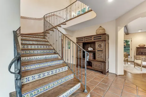 a bedroom with a bed and utility lamp