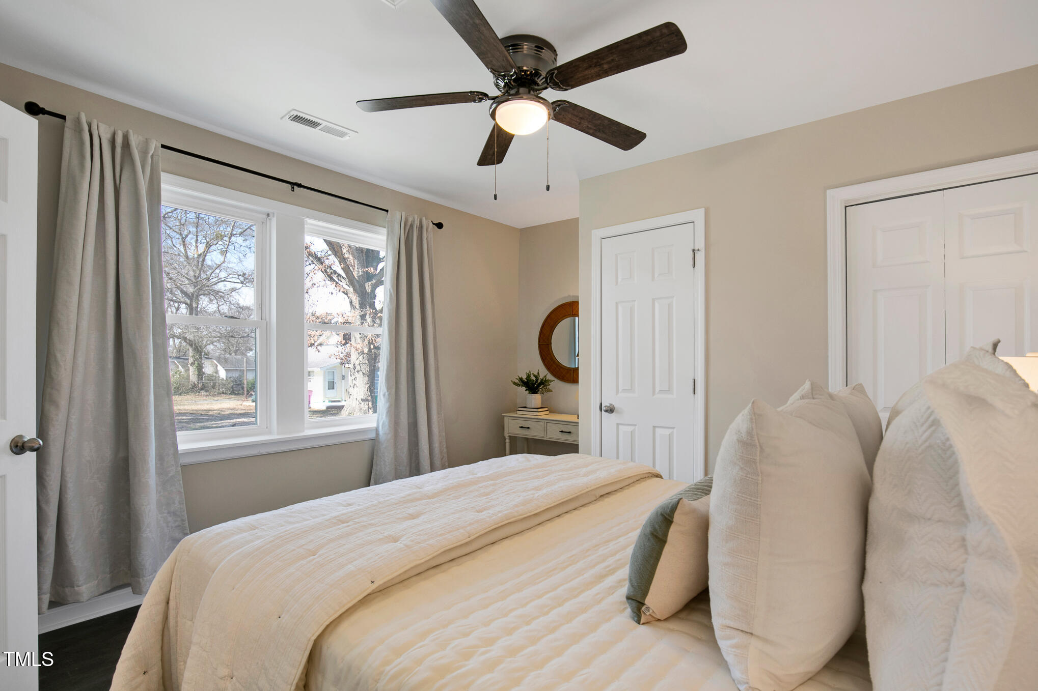 302 St Augustine Raleigh, NC 27610 - Photo 12 of 27 a bedroom with a bed ceiling fan and a window