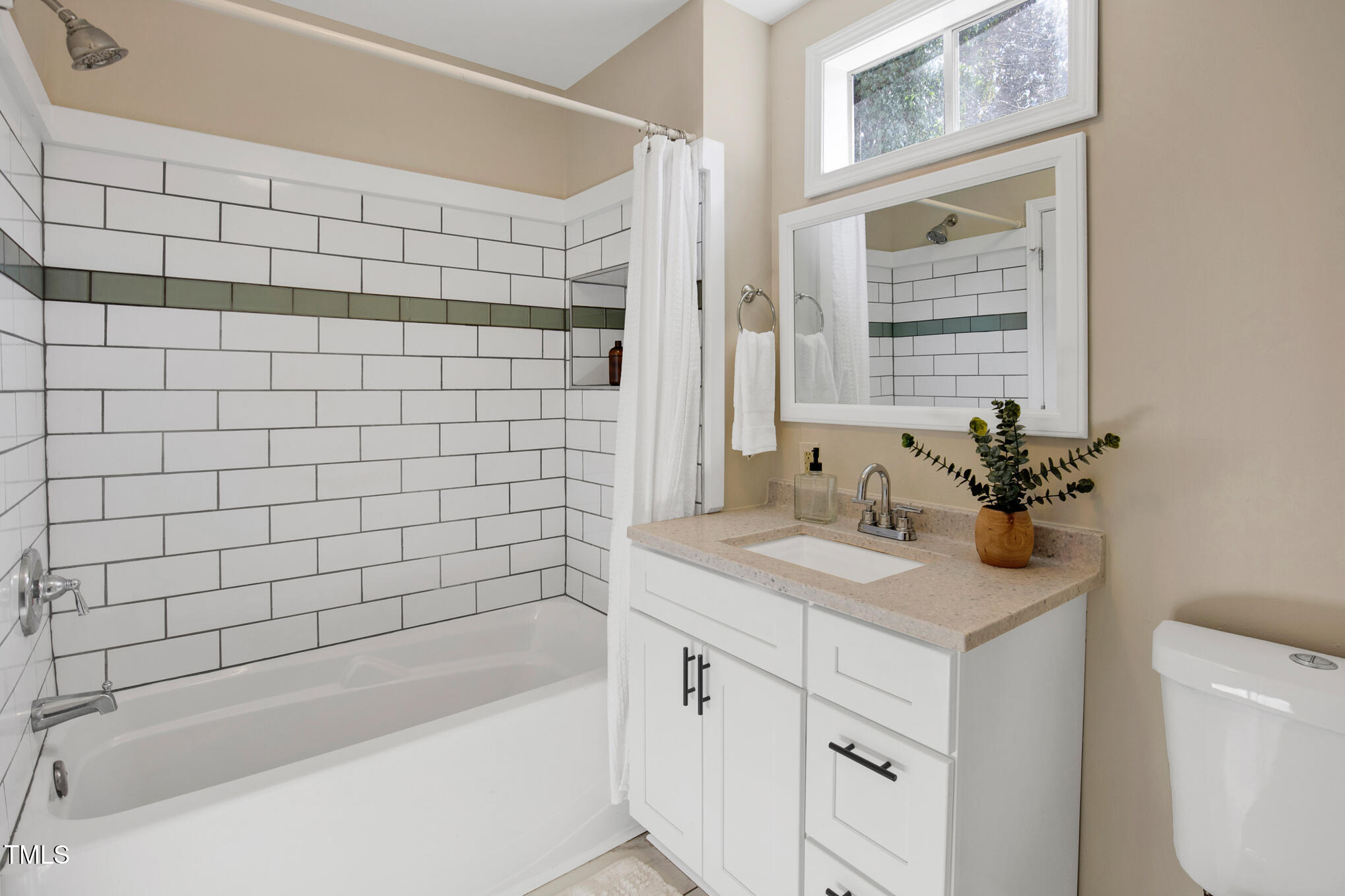 302 St Augustine Raleigh, NC 27610 - Photo 17 of 27 a bathroom with a sink a toilet and shower