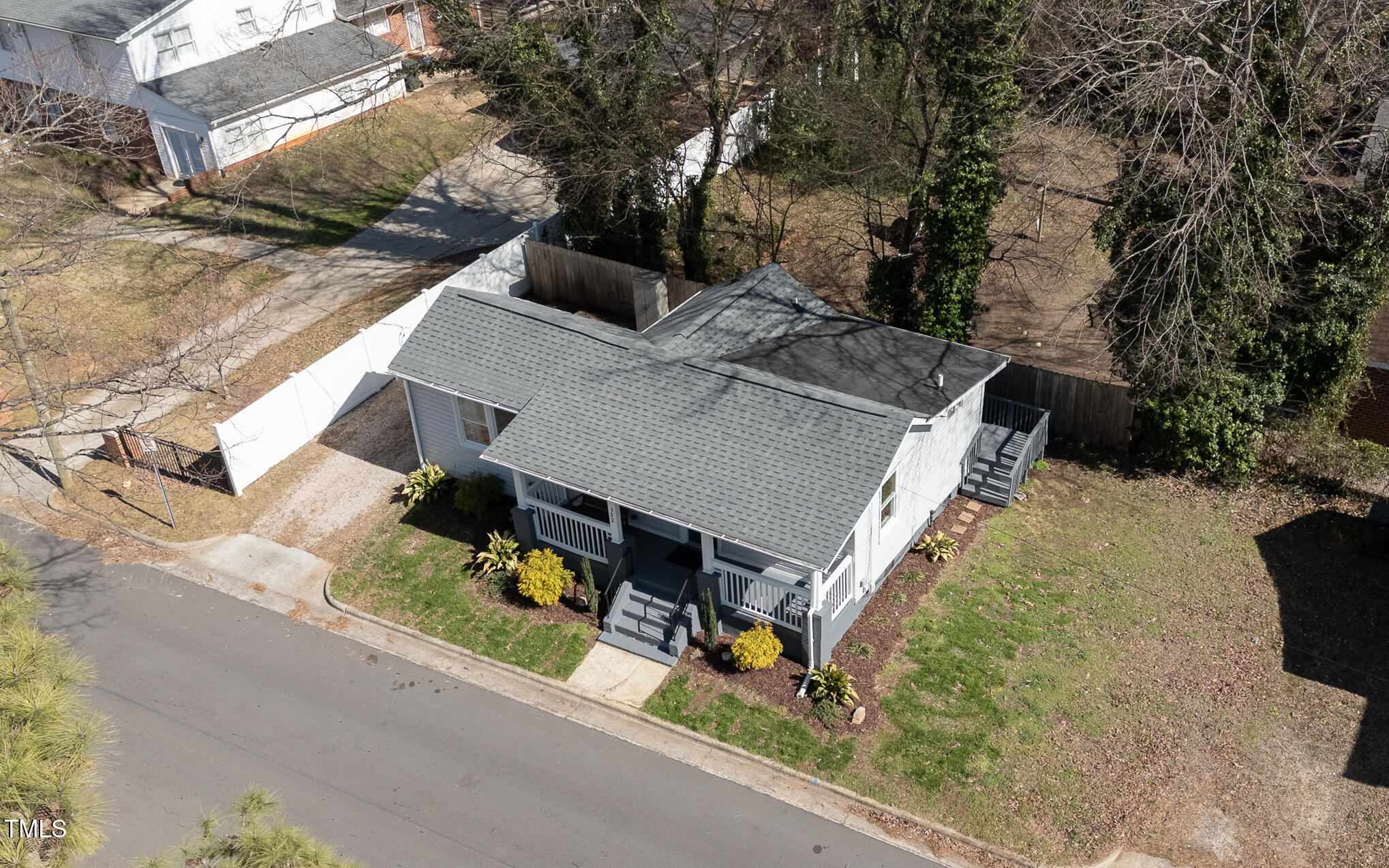 302 St Augustine Raleigh, NC 27610 - Photo 23 of 27 an aerial view of a house with swimming pool and large trees