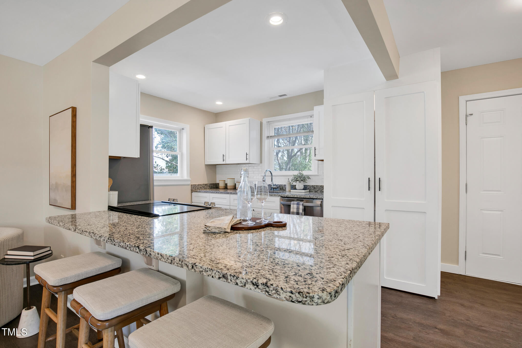 302 St Augustine Raleigh, NC 27610 - Photo 7 of 27 a kitchen with granite countertop kitchen island stainless steel appliances a sink and counter space